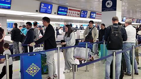 Passengers depart from Dubai International Airport as UAE airports brace for a surge in arrivals, with residents returning home after the winter holidays ahead of school reopening.