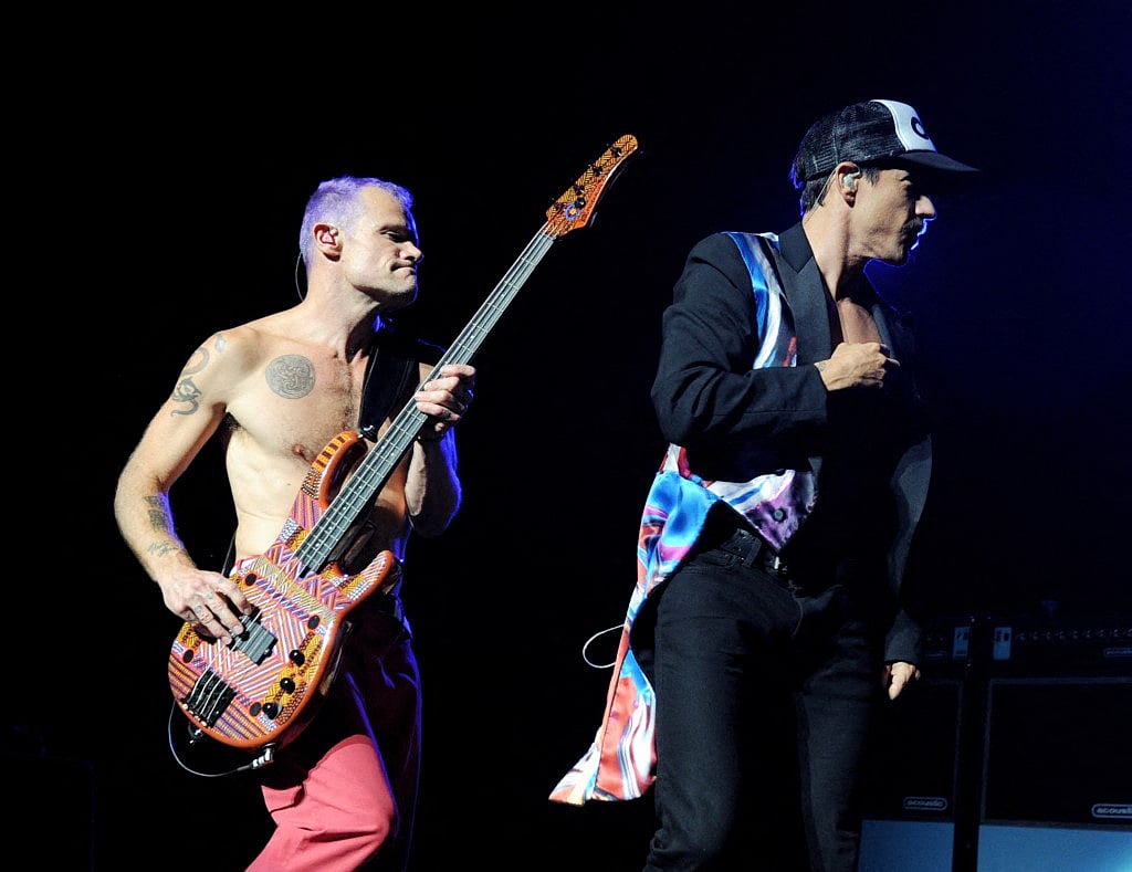 Musician Flea (L) and singer Anthony Kiedis of the Red Hot Chili Peppers perform at L.A. Live's Club Nokia to benefit The Silverlake Conservatory of Music on August 24, 2011 in Los Angeles, California.