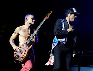 Musician Flea (L) and singer Anthony Kiedis of the Red Hot Chili Peppers perform at L.A. Live's Club Nokia to benefit The Silverlake Conservatory of Music on August 24, 2011 in Los Angeles, California.