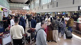 Passengers arrive at Dubai International Airport as UAE airports brace for a surge in arrivals, with residents returning home after the winter holidays ahead of school reopening.