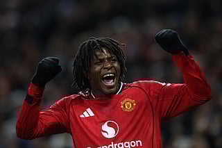 Manchester United's Danish defender #13 Patrick Dorgu celebrates after scoring the opening goal of the English Premier League football match between Manchester United and Newcastle United at Old Trafford in Manchester, north west England, on December 26, 2025.