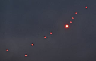 This photograph taken on December 27, 2025 shows Ukrainian air defence firing at drones during a Russian drones and missiles attack, in Kyiv.