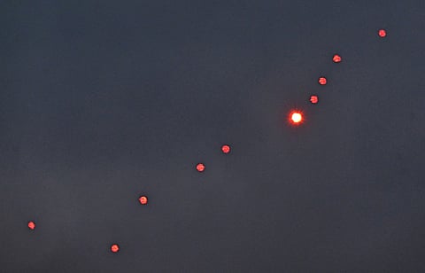 This photograph taken on December 27, 2025 shows Ukrainian air defence firing at drones during a Russian drones and missiles attack, in Kyiv.