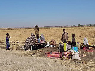 Displaced Sudanese react after spending a night in Gedaref city eastern Sudan on December 26, 2025. 