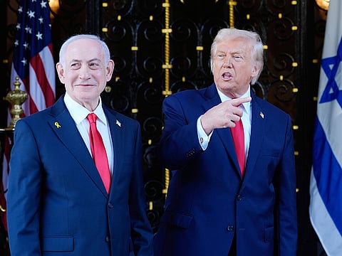 President Donald Trump speaks to reporters as he greets Israel's Prime Minister Benjamin Netanyahu at his Mar-a-Lago club, on Monday, December 29, 2025, in Palm Beach, Florida. 