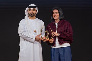 Sheikh Mansoor Bin Mohammed Bin Rashid Al Maktoum, Chairman of the Dubai Sports Council presenting the Arab Outstanding Sporting Career award to Tunisian tennis players Ons Jabeur on the opening day of World Sports Summit in Dubai on Monday.