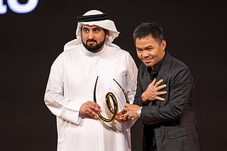 Sheikh Ahmed Bin Mohammed Bin Rashid Al Maktoum, Second Deputy Ruler of Dubai and Chairman of the Dubai Media Council  presenting the award to legendary Filipino boxer Manny Pacquiao on the opening day of World Sports Summit in Dubai on Monday.