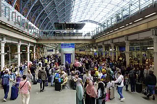 Rail travellers gather at the Eurostar terminal of St Pancras International railway station, London.