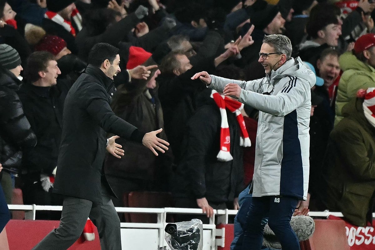 Arsenal's Spanish manager Mikel Arteta (L) celebrates with Dutch assistant coach Albert Stuivenberg (R) after they score their fourth goal during the English Premier League football match against Aston Villa at the Emirates Stadium in London on December 30, 2025.
