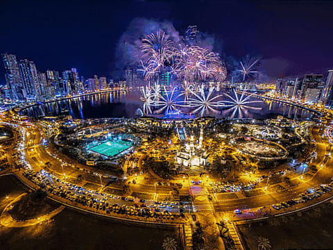 People at Burj Park gather to witness the fireworks on the New years eve in Dubai