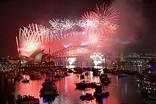 Fireworks light up the midnight sky over Sydney Harbour Bridge and Sydney Opera House during New Year’s Day celebrations in Sydney on January 1, 2026.