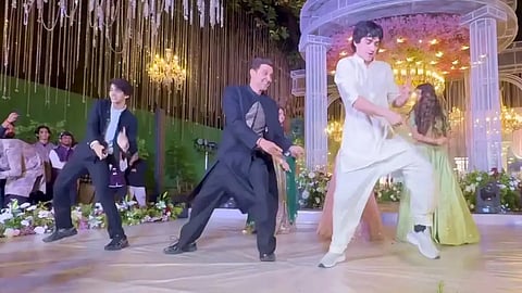 Hrithik Roshan, Bollywood's answer to effortless cool, was caught on camera absolutely owning the dance floor at a family wedding and bringing his sons along for the ride.