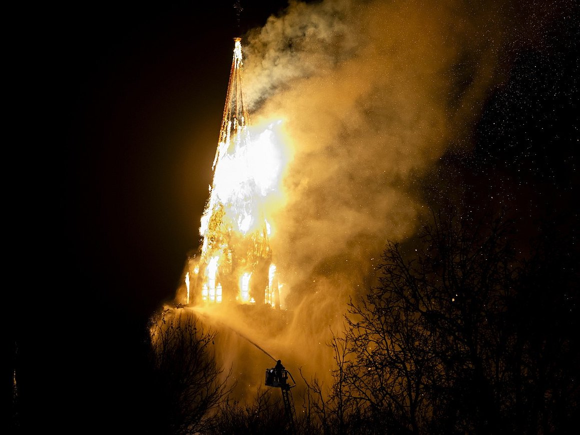 A fire tears through the Vondelkerk church tower in Amsterdam on New Year's eve 