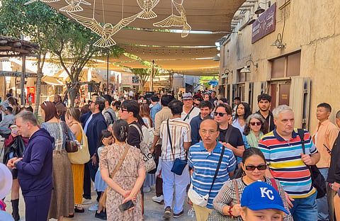 Tourists enjoy the lively atmosphere at Al Seef in Dubai, one of the city’s popular heritage and waterfront destinations.