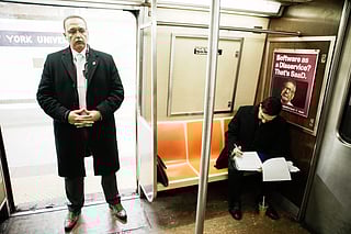 New York City Mayor Zohran Mamdani checks his agenda on the subway on his way to City Hall in New York, Friday, Jan. 2, 2026. 