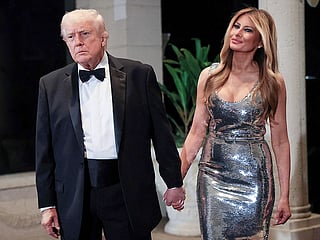 US President Donald Trump and first lady Melania Trump arrive for a New Year’s Eve event at his Mar-a-Lago home on December 31, 2025 in Palm Beach, Florida.
