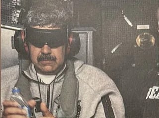 Trump posts photo of handcuffed, blindfolded Maduro on US Naval Ship