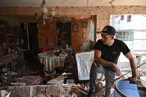 Jesus Linares is seen at his damaged apartment in Catia La Mar, La Guaira State, Venezuela, on January 4, 2026, a day after Venezuela's leader Nicolas Maduro was captured in a US strike.