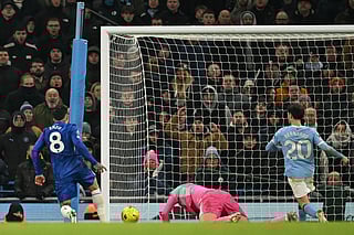 Chelsea's Argentinian midfielder #08 Enzo Fernandez (L) scores their first goal during the English Premier League football match against Manchester City at the Etihad Stadium in Manchester, north west England, on January 4, 2026.