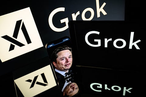 This photograph taken on January 13, 2025 in Toulouse shows screens displaying the logo of Grok, a generative artificial intelligence chatbot developed by xAI, the American company specializing in artificial intelligence and it's founder South African businessman Elon Musk.