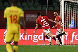Egypt's forward Mohamed Salah (R) celebrates scoring his team's third goal during the Africa Cup of Nations (CAN) round of 16 football match between Egypt and Benin at the Grand Stadium in Agadir on January 5, 2026.