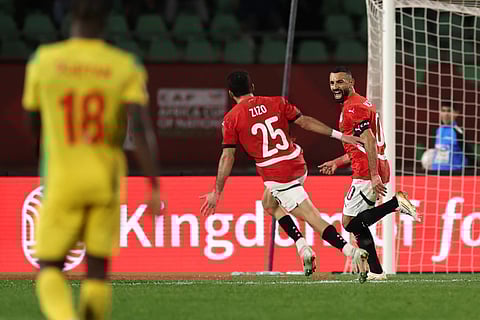 Egypt's forward Mohamed Salah (R) celebrates scoring his team's third goal during the Africa Cup of Nations (CAN) round of 16 football match between Egypt and Benin at the Grand Stadium in Agadir on January 5, 2026.