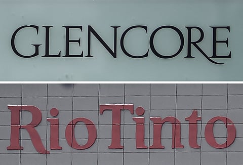 This combination of file images made on January 8, 2026, shows (top) the logo of commodity trading and mining company giant Glencore in Baar on May 28, 2025; and (bottom) the logo of global mining and metals company Rio Tinto in Perth on November 24, 2025.