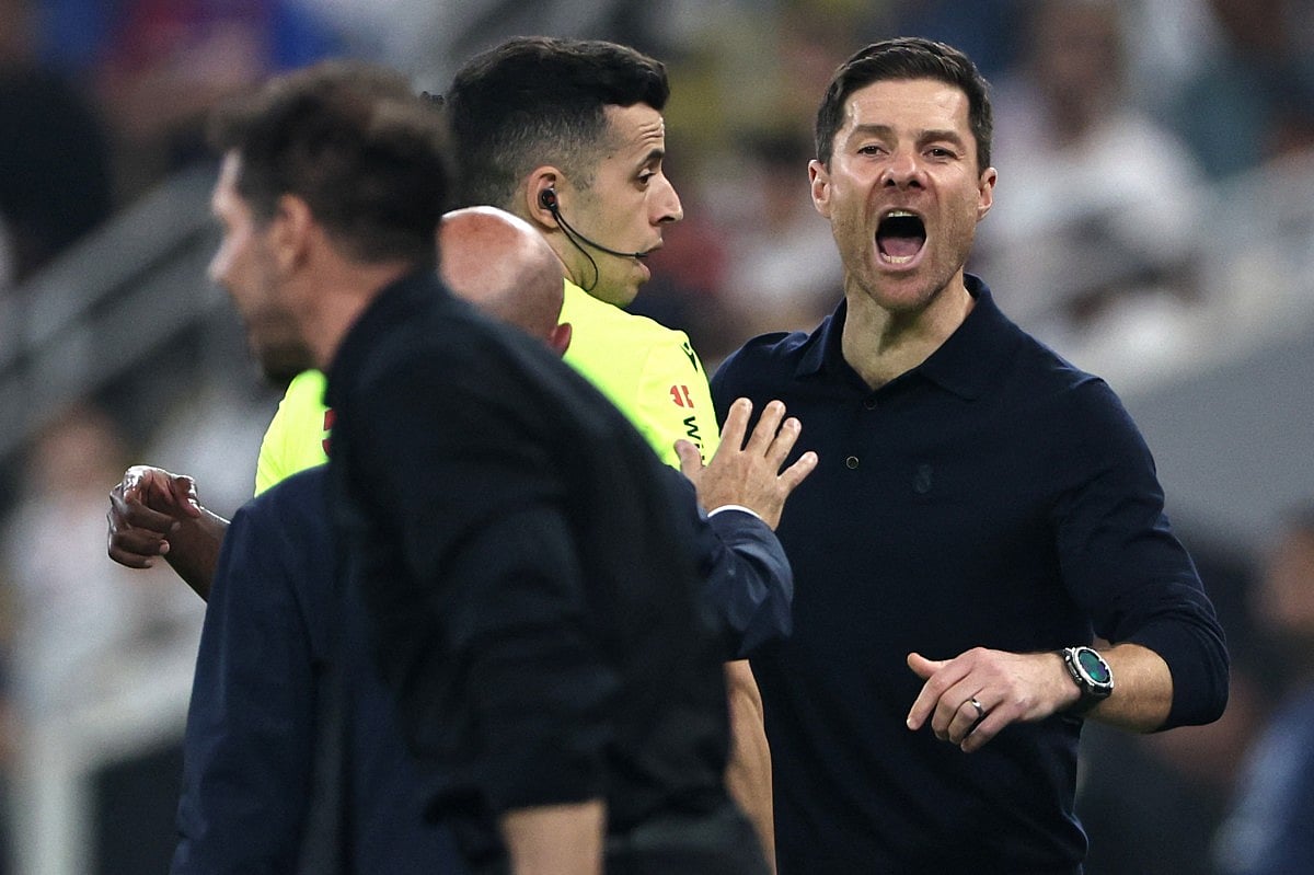 Real Madrid's Spanish coach Xabi Alonso shouts at Atletico Madrid's Argentine coach Diego Simeone during the Spanish Supercup semi-final football match between Atletico Madrid and Real Madrid at King Abdullah Sports City in Jeddah on January 8, 2026.
