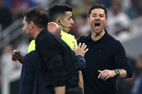 Real Madrid's Spanish coach Xabi Alonso shouts at Atletico Madrid's Argentine coach Diego Simeone during the Spanish Supercup semi-final football match between Atletico Madrid and Real Madrid at King Abdullah Sports City in Jeddah on January 8, 2026.