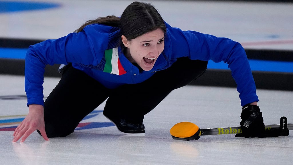 FILE -Italy's Stefania Constantini, directs her team mate, during the mixed doubles curling match against Sweden, at the 2022 Winter Olympics, Feb. 6, 2022, in Beijing. (AP Photo/Nariman El-Mofty, File)