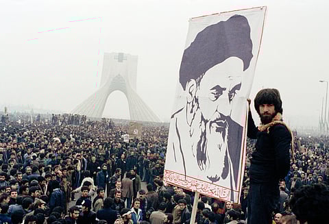 FILE - In this Oct. 9, 1978 file photo, Iranian protesters demonstrate against Shah Mohammad Reza Pahlavi in Tehran, Iran. (AP Photo, File)