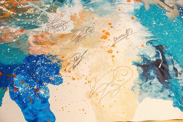 A canvas signed by legendary footballers on display at the launch event.