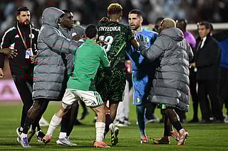 Nigeria's midfielder #18 Raphael Onyedika, Algeria's goalkeeper #23 Luca Zidane and players argue during the Africa Cup of Nations (CAN) quarter-final football match between Algeria and Nigeria at the Grand stadium in Marrakesh on January 10, 2026.