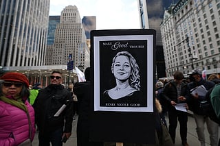 A person holds a poster of Renee Nicole Good who was shot and killed by a US Immigration and Customs Enforcement (ICE) agent in Minneapolis, Minnesota during a protest organised by Rise and Resist against US Immigration and Customs Enforcement (ICE) activities and the US intervention in Venezuela in New York on January 11, 2026.