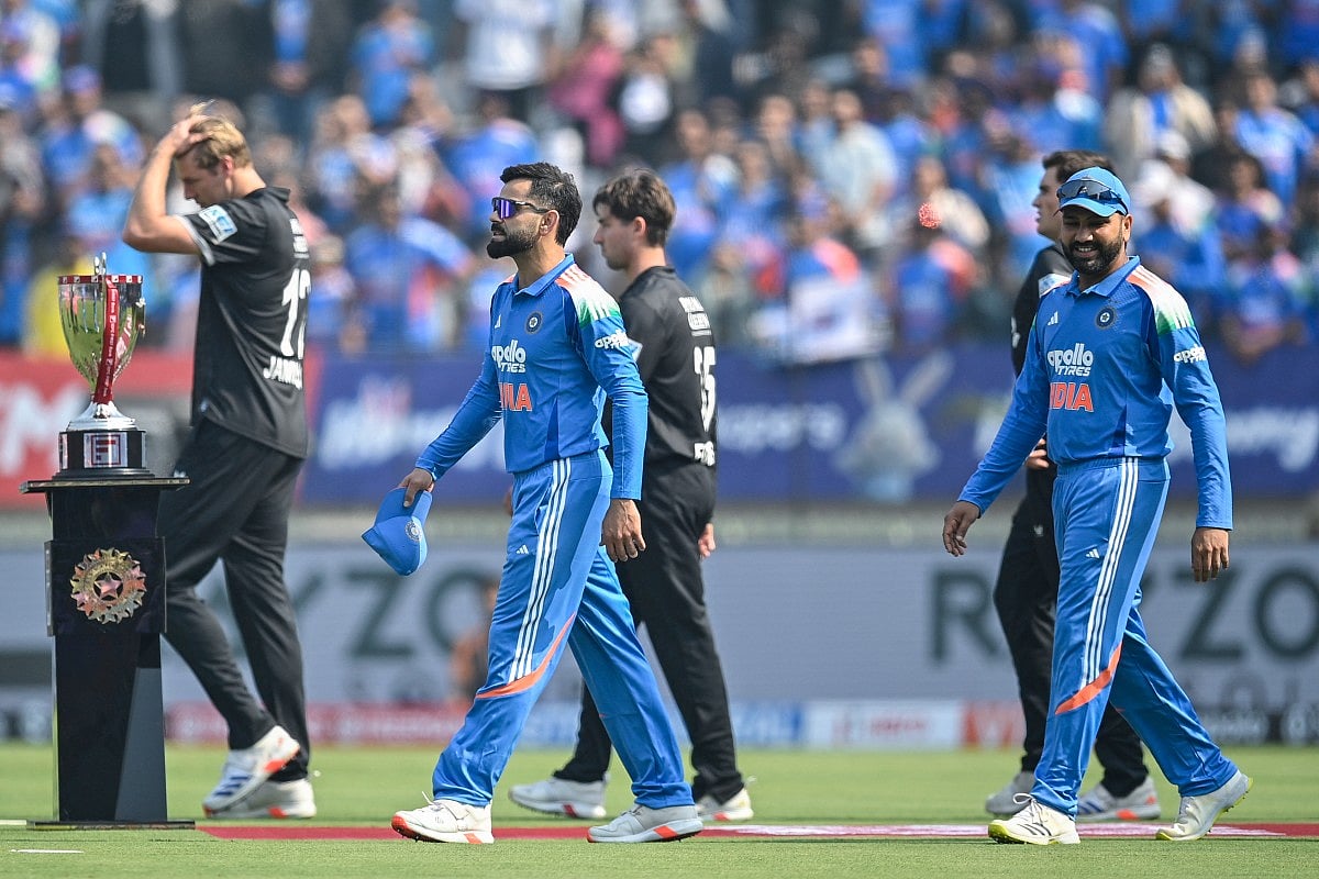 India's Virat Kohli (L) and Rohit Sharma.