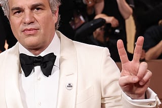US actor Mark Ruffalo US wears a pin reading "be Good", in tribute to Renee Good, who was fatally shot by a US Immigration and Customs Enforcement (ICE) agent in Minneapolis, as she attends the 83rd annual Golden Globe Awards at the Beverly Hilton hotel in Beverly Hills, California, on January 11, 2026.