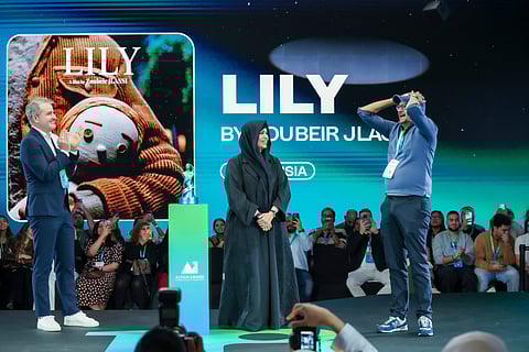 Tunisian filmmaker Zoubeir Jlassi reacts after winning the world’s largest AI Film Award for his film Lily. Sheikha Latifa bint Mohammed bin Rashid Al Maktoum handed him over the award at the1 Billion Followers Summit in Dubai.