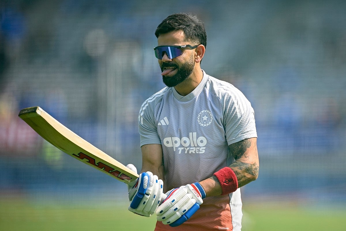 India's Virat Kohli gestures as he warms up before the start of the first one-day international (ODI) cricket match between India and New Zealand at the Kotambi Stadium in Vadodara on January 11, 2026.