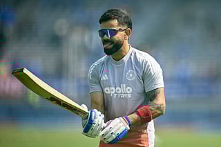 India's Virat Kohli gestures as he warms up before the start of the first one-day international (ODI) cricket match between India and New Zealand at the Kotambi Stadium in Vadodara on January 11, 2026.