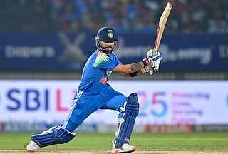 India's Virat Kohli watches the ball after playing a shot during the first one-day international (ODI) cricket match between India and New Zealand at the Kotambi Stadium in Vadodara on January 11, 2026.