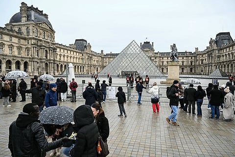 Tourists pack the Louvre despite steep entry fee hike