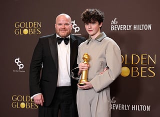 Andy Cooper and Owen Cooper, winner of the Best Performance by a Male Actor in a Supporting Role on Television Award for "Adolescence" poses in the press room during the 83rd Annual Golden Globe Awards at The Beverly Hilton on January 11, 2026 in Beverly Hills, California.