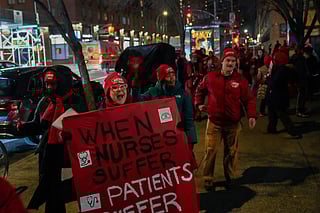 Nurses strike outside Mount Sinai West Hospital, Monday, Jan. 12, 2026, in New York. 