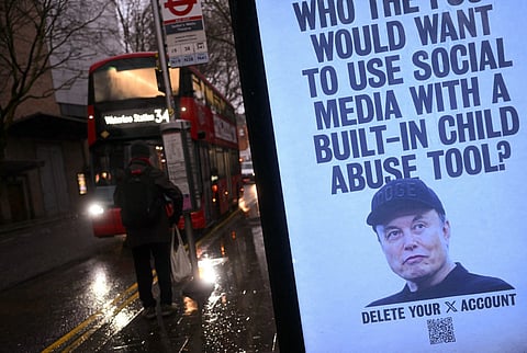 A poster featuring an image of US billionaire and businessman Elon Musk, calling for users of his X social media platform to delete their accounts due to the AI chatbot Grok's image-creation feature, is pictured installed in a bus stop by activists from UK collective 'Everyone Hates Elon', in London on January 13, 2026.