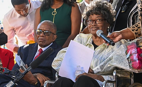 African American civil rights pioneer Claudette Colvin (R) speaks next to civil rights attorney Fred Gray during a press conference after Colvin petitioned for her juvenile record to be expunged at the Montgomery County Family Court on October 26, 2021, in Montgomery, Alabama.