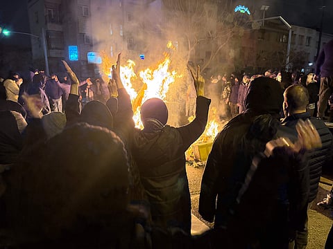 Iranians attend an anti-government protest in Tehran, Iran. 