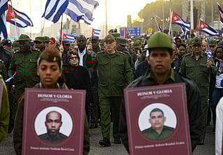 Cuba's President Miguel Diaz-Canel (C) takes part in the "Anti-Imperialist" protest in front of the US Embassy against the US incursion in Venezuela, where 32 Cuban soldiers lost their lives, in Havana on January 16, 2026.