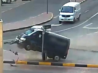 The impact is forceful enough to briefly lift the rear of the van off the ground