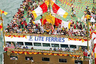 The ead ship, surrounded by smaller boats on the Mactan Channel. The event formed part of the 461st Fiesta Señorcelebrations leading up to the Sinulog Festival on Sunday (January 18).
