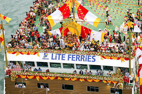 The ead ship, surrounded by smaller boats on the Mactan Channel. The event formed part of the 461st Fiesta Señorcelebrations leading up to the Sinulog Festival on Sunday (January 18).